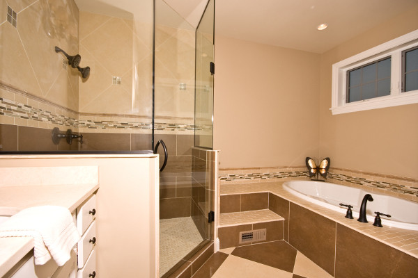 Elegant master brown tile and porcelain tile porcelain tile bathroom photo in Milwaukee with an undermount sink, shaker cabinets, white cabinets, marble countertops and beige walls