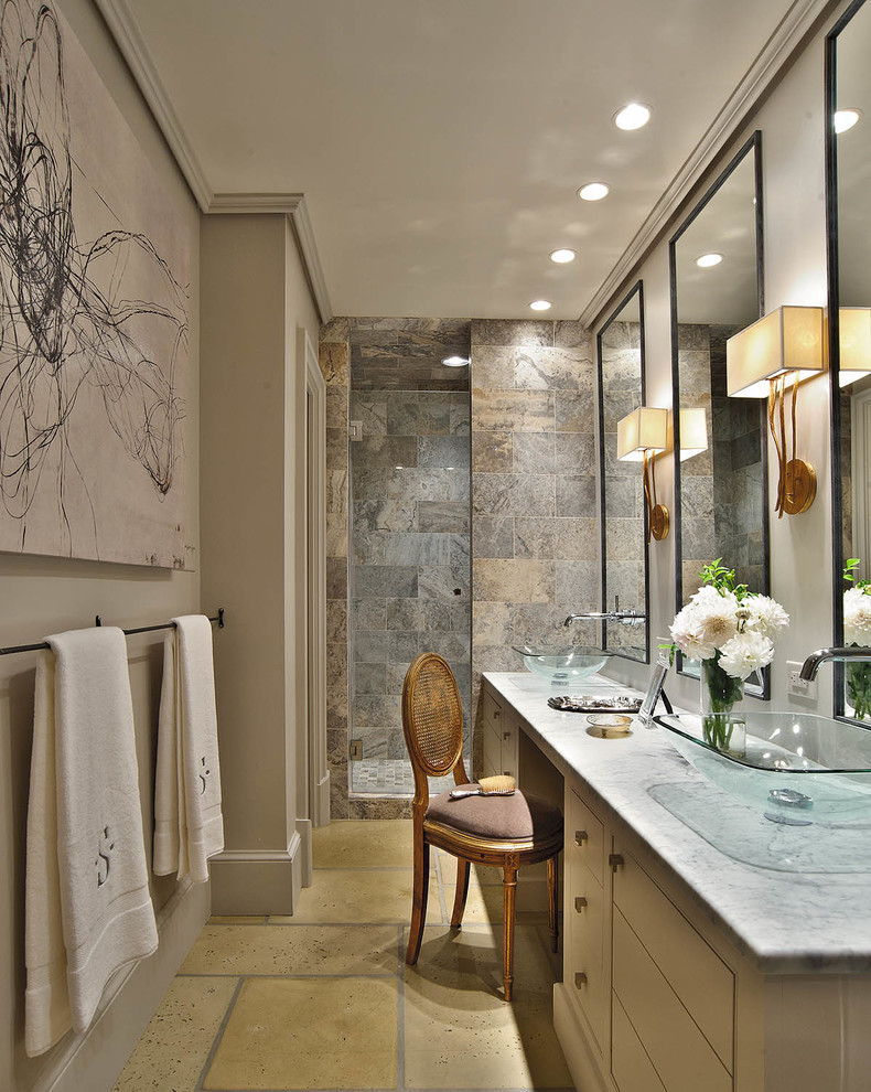 Photo of a small contemporary ensuite bathroom in Charlotte with onyx worktops, a vessel sink, flat-panel cabinets, white cabinets, an alcove shower, a two-piece toilet, brown tiles, stone tiles, grey walls and concrete flooring.