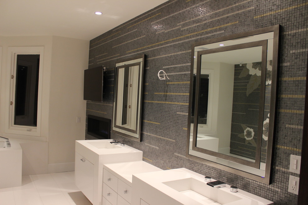Inspiration for a large contemporary ensuite bathroom in Los Angeles with flat-panel cabinets, white cabinets, a submerged bath, an alcove shower, grey tiles, white tiles, yellow tiles, mosaic tiles, white walls, porcelain flooring, an integrated sink and engineered stone worktops.