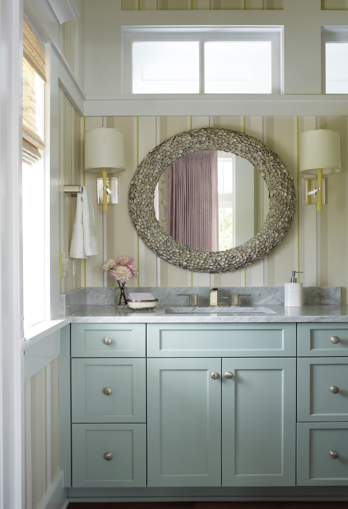 Bathroom - coastal bathroom idea in Charleston with an undermount sink, recessed-panel cabinets and blue cabinets