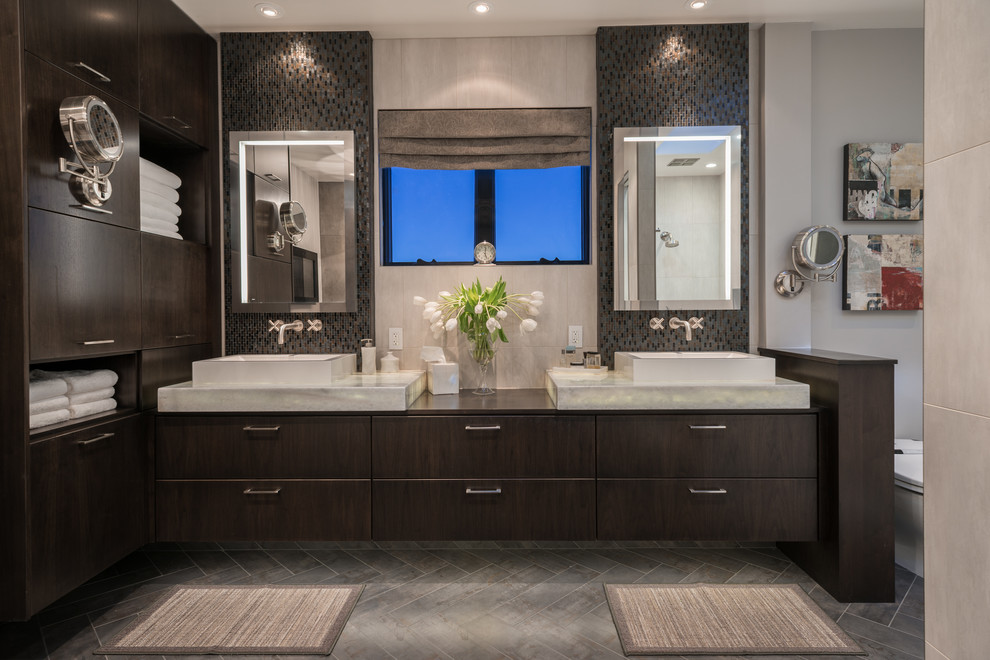 Design ideas for a large mediterranean ensuite bathroom in San Francisco with a vessel sink, dark wood cabinets, a freestanding bath and a built-in shower.