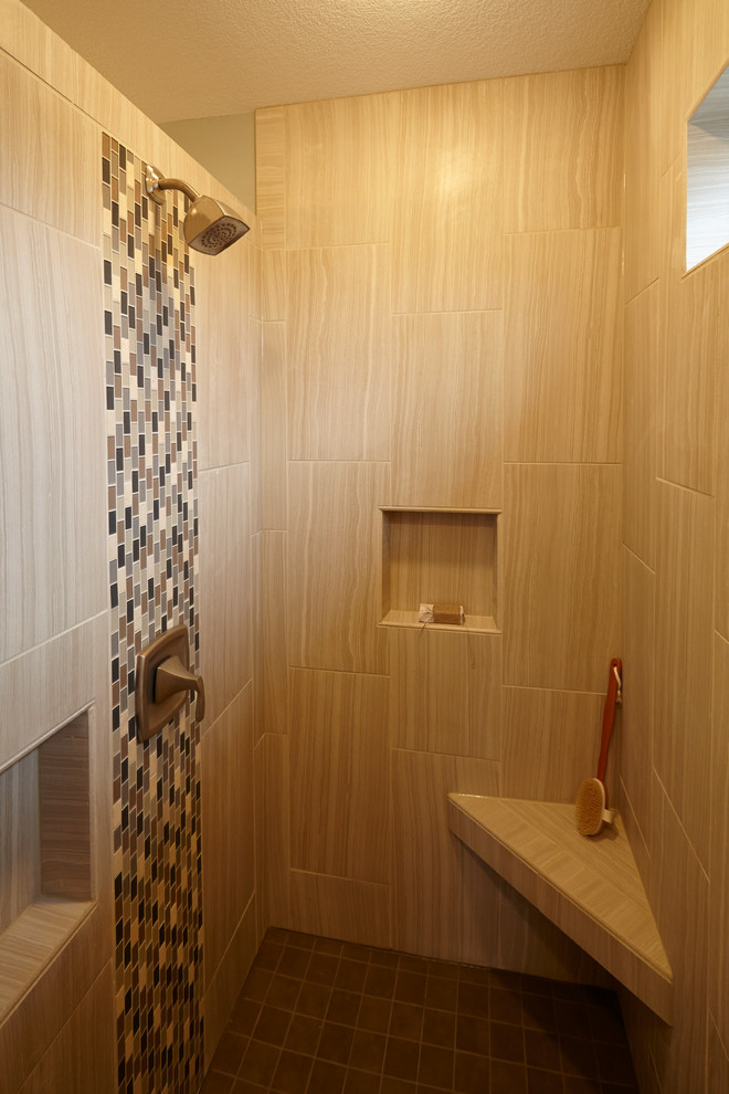 Photo of a medium sized classic ensuite bathroom in Milwaukee with an integrated sink, recessed-panel cabinets, light wood cabinets, a walk-in shower, a one-piece toilet, beige tiles, ceramic tiles, beige walls and ceramic flooring.