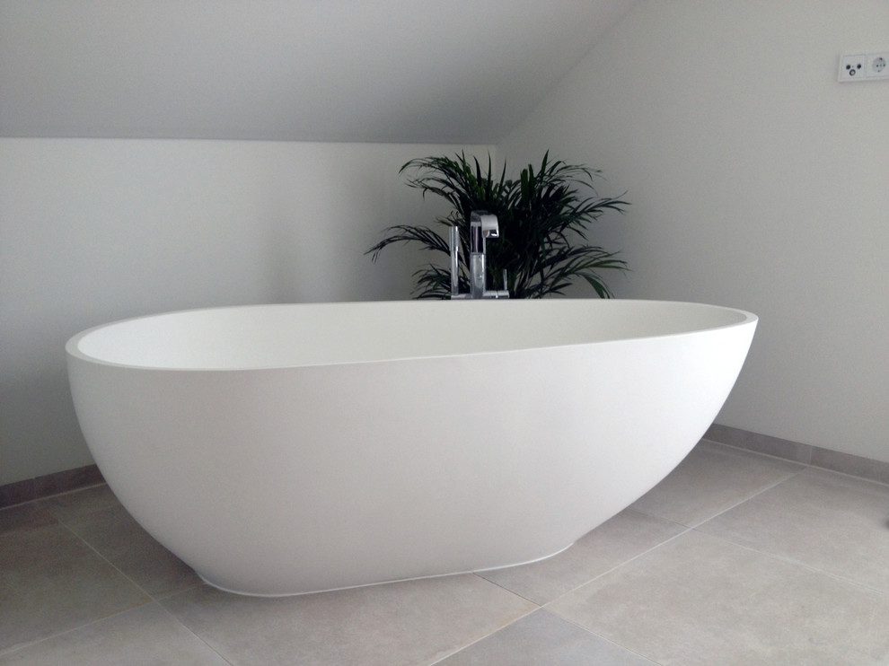 This is an example of a medium sized modern ensuite bathroom in San Francisco with a freestanding bath.