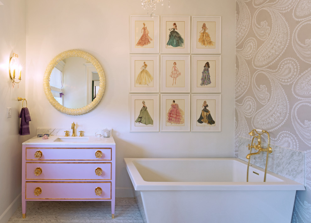 Elegant freestanding bathtub photo in Los Angeles with flat-panel cabinets and pink cabinets
