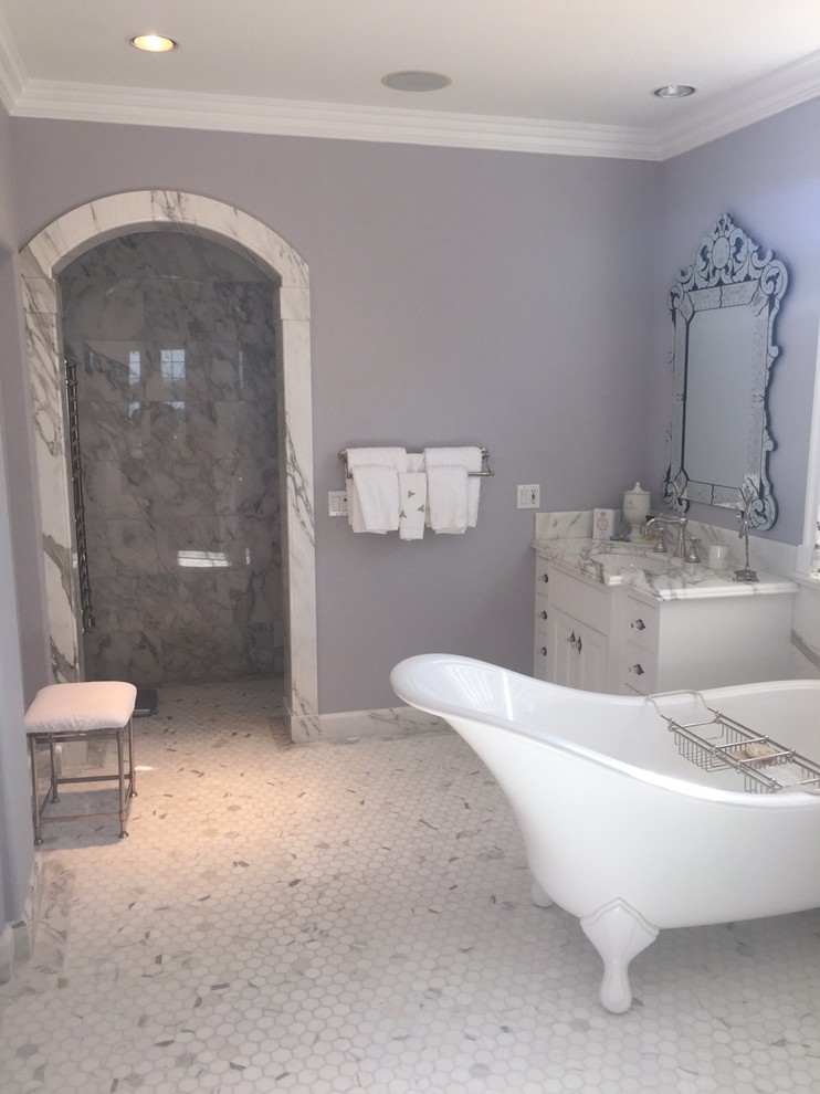 Inspiration for a large timeless master white tile and mosaic tile marble floor bathroom remodel in Los Angeles with marble countertops, raised-panel cabinets, white cabinets, purple walls and an undermount sink