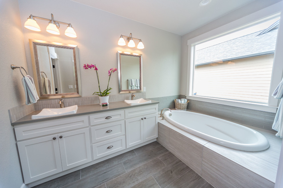 Example of a mid-sized classic master beige tile and mosaic tile porcelain tile bathroom design in Portland with shaker cabinets, white cabinets, white walls, a drop-in sink and concrete countertops