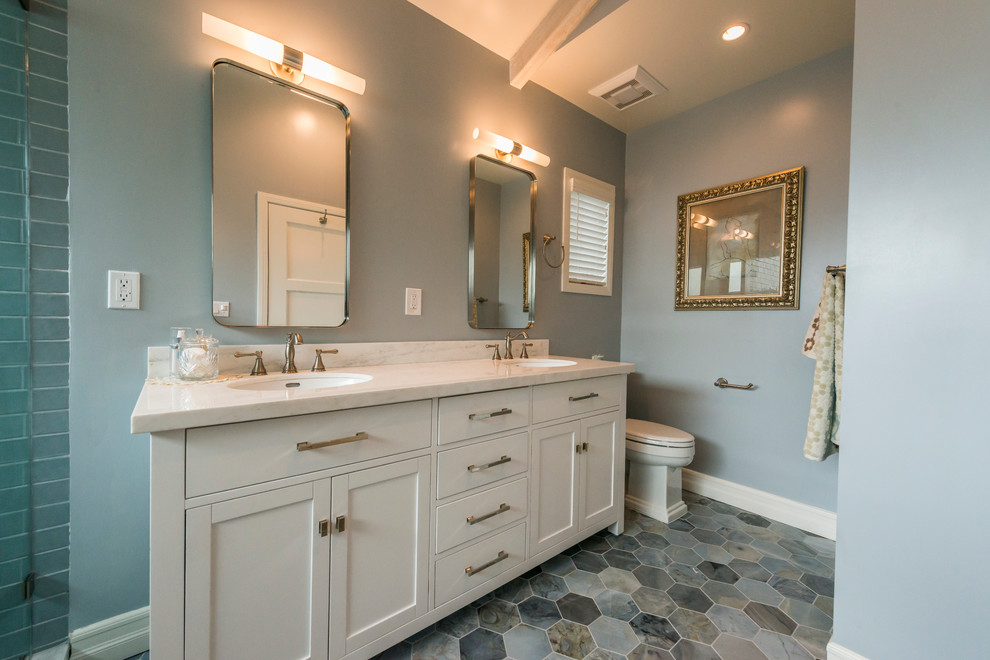Large transitional master blue tile, gray tile and porcelain tile mosaic tile floor and multicolored floor double shower photo in Los Angeles with shaker cabinets, white cabinets, gray walls, an undermount sink, marble countertops, a hinged shower door and white countertops