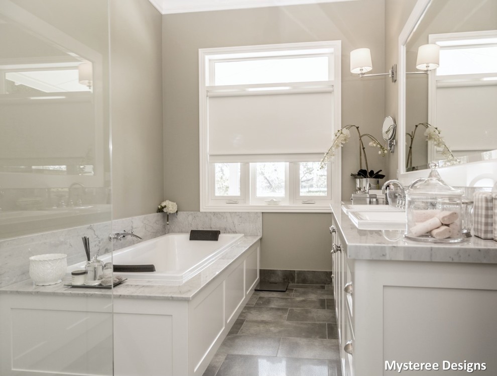 Traditional bathroom in Other with shaker cabinets, white cabinets, a walk-in shower, grey tiles, ceramic flooring, an integrated sink and marble worktops.