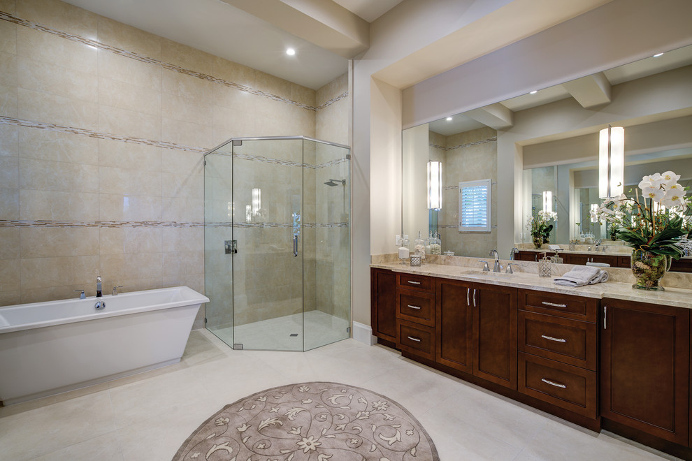 Design ideas for a mediterranean ensuite wet room bathroom with dark wood cabinets, a freestanding bath, beige tiles, beige walls, a built-in sink, white floors and a hinged door.