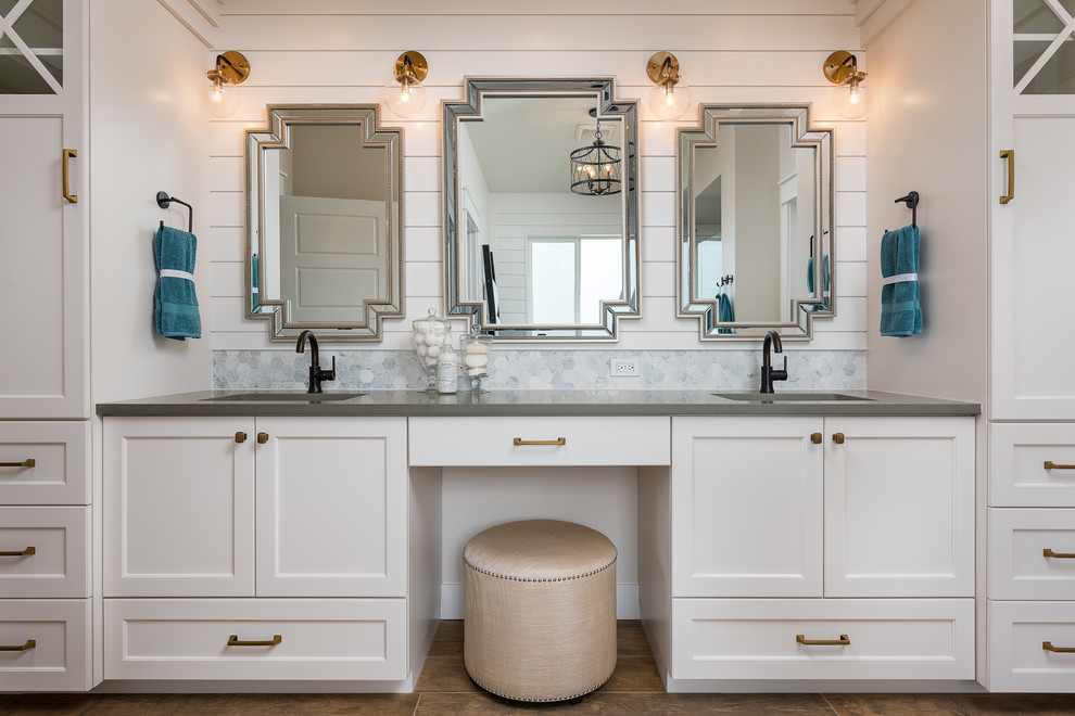 Mid-sized transitional master white tile and porcelain tile vinyl floor and brown floor bathroom photo in Boise with shaker cabinets, white cabinets, white walls, an undermount sink, quartzite countertops and a hinged shower door