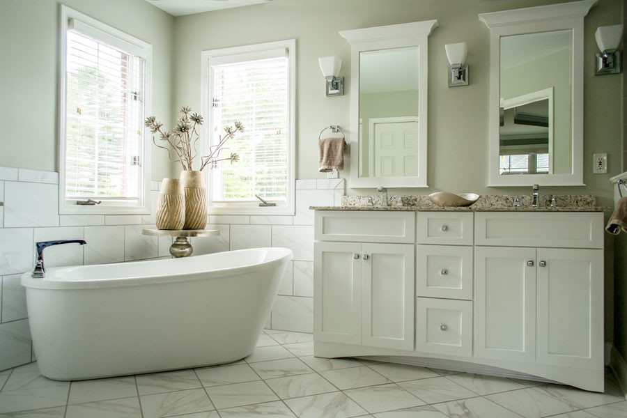 Bathroom - mid-sized transitional master white tile and ceramic tile ceramic tile and white floor bathroom idea in Louisville with flat-panel cabinets, white cabinets, a one-piece toilet, gray walls, an undermount sink, quartzite countertops and a hinged shower door