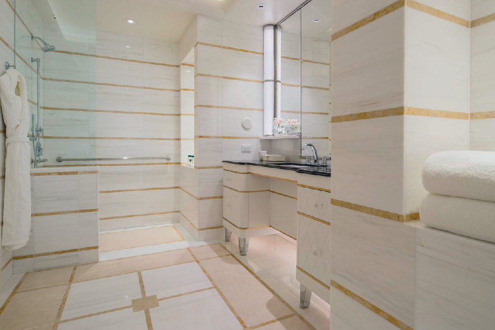 Bathroom - large modern master multicolored tile and marble tile marble floor and multicolored floor bathroom idea in Los Angeles with white cabinets, multicolored walls, an undermount sink, marble countertops, a hinged shower door, black countertops and beaded inset cabinets