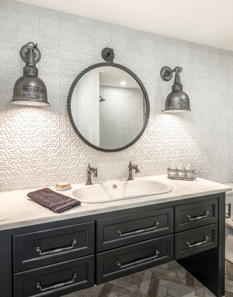 Example of a large minimalist 3/4 white tile and ceramic tile bathroom design in Other with recessed-panel cabinets, black cabinets, quartz countertops and white countertops