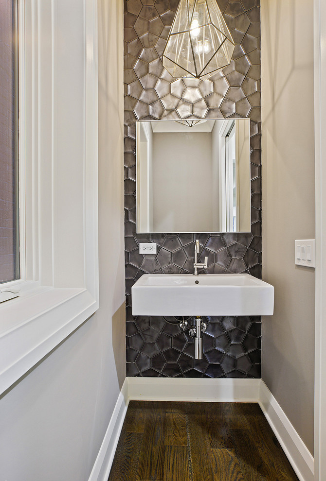 Photo of a small contemporary bathroom in Chicago with a one-piece toilet, black tiles, ceramic tiles, grey walls, dark hardwood flooring and a wall-mounted sink.