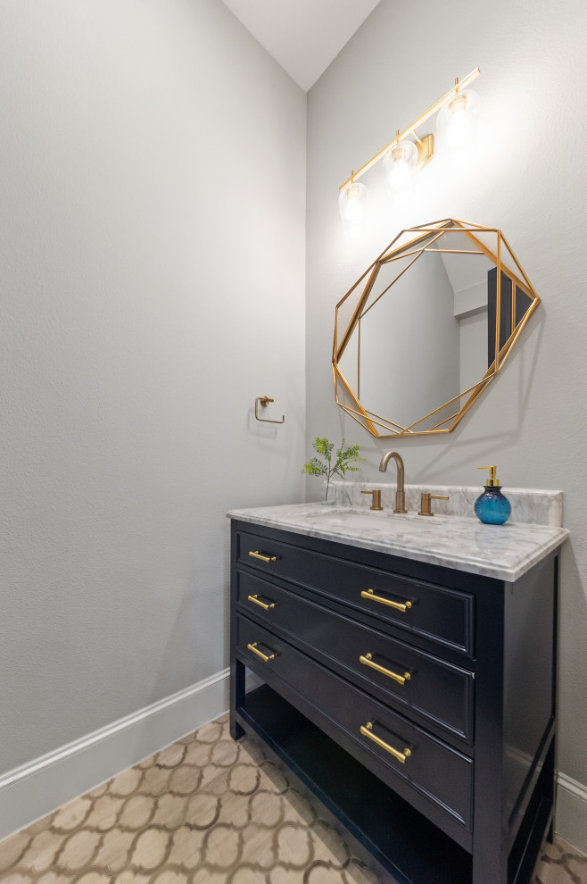 This is an example of a small rural bathroom in Dallas with freestanding cabinets, blue cabinets, grey tiles, grey walls, mosaic tile flooring, a submerged sink, quartz worktops, beige floors, grey worktops, a single sink and a built in vanity unit.