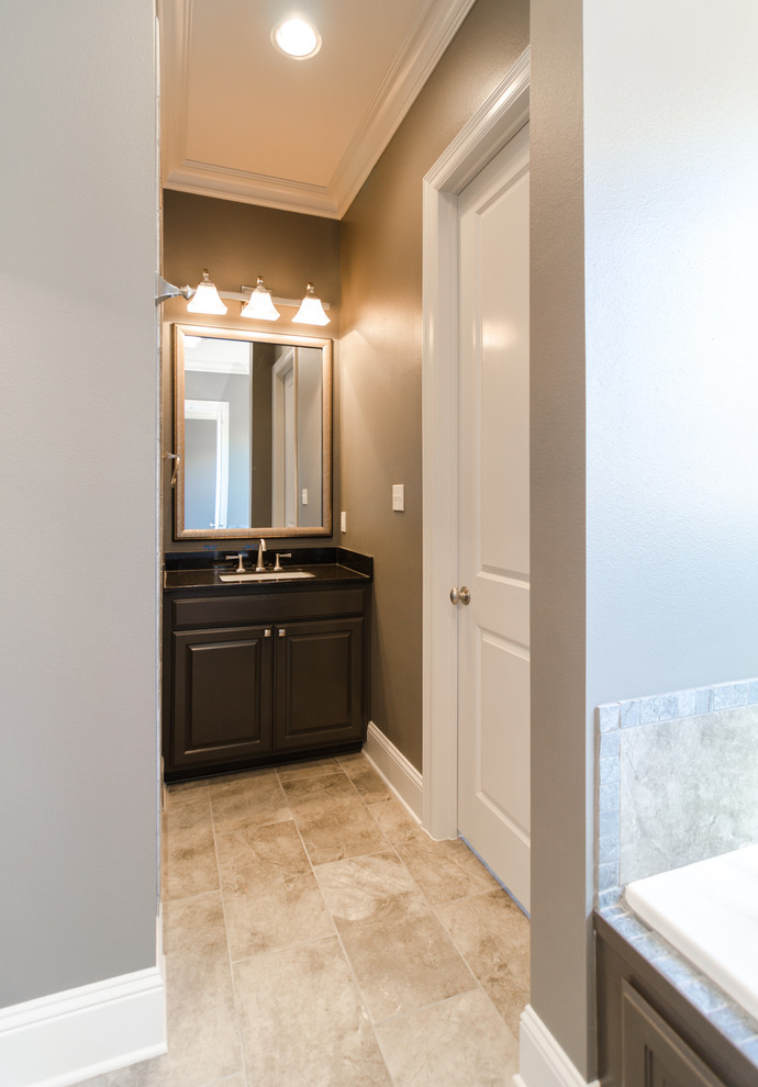 Walk-in shower - modern master walk-in shower idea in New Orleans with a drop-in sink, raised-panel cabinets, gray cabinets, granite countertops, a hot tub and gray walls