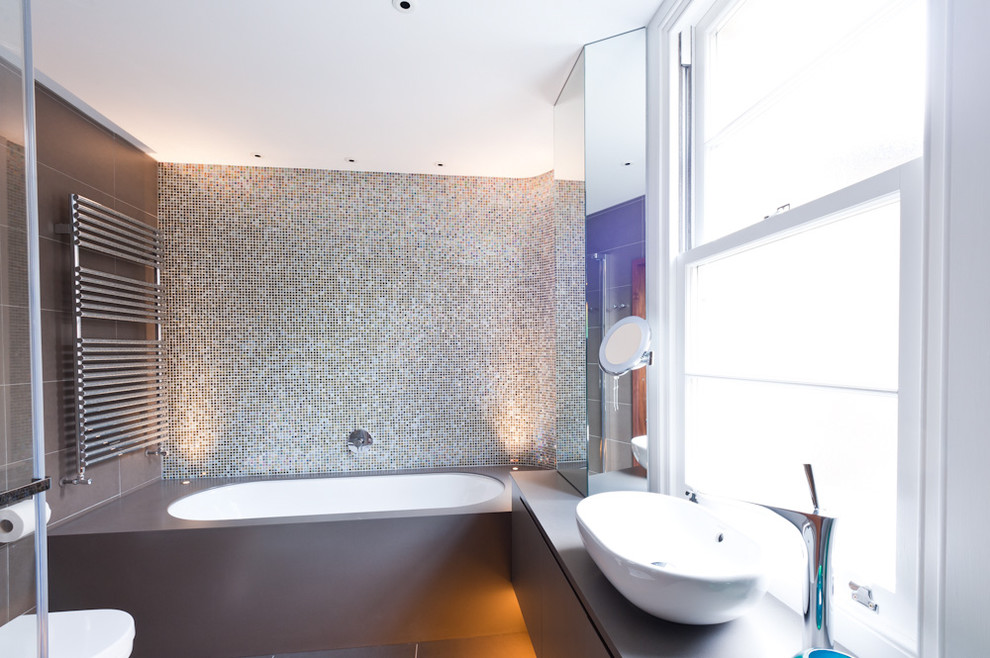 Inspiration for a contemporary bathroom in Other with a vessel sink.