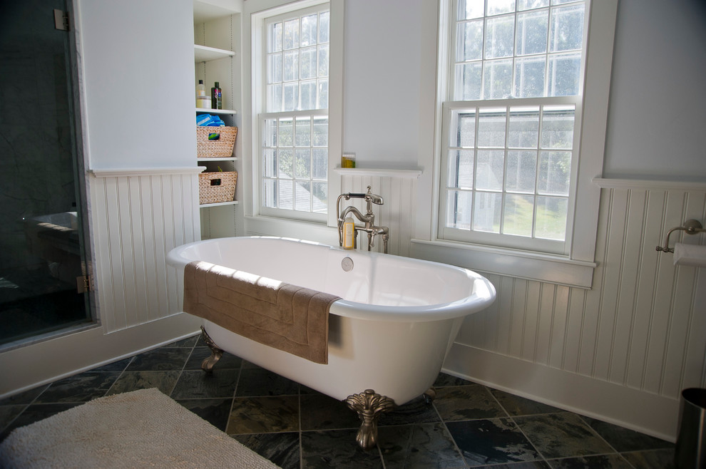 Inspiration for a large farmhouse master stone tile and gray tile slate floor bathroom remodel in Boston with a vessel sink, a two-piece toilet, white walls and a hinged shower door