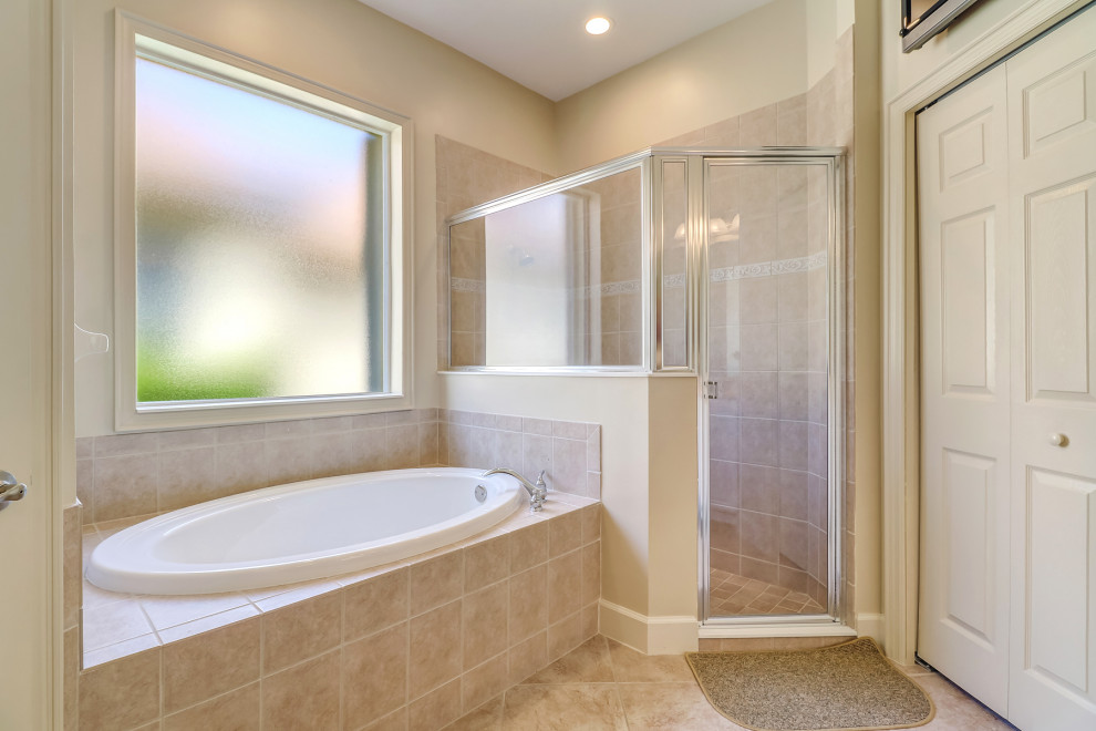 Inspiration for a mid-sized timeless master beige tile and ceramic tile ceramic tile, beige floor and double-sink bathroom remodel in Other with open cabinets, beige cabinets, a one-piece toilet, beige walls, a drop-in sink, granite countertops, beige countertops and a built-in vanity