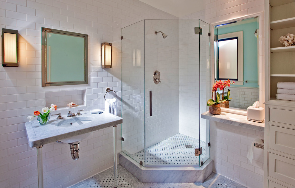 Example of a mid-sized transitional master white tile and subway tile mosaic tile floor corner shower design in San Francisco with a console sink, flat-panel cabinets, white cabinets, marble countertops, a one-piece toilet and white walls