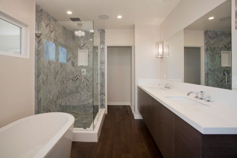 Large minimalist master medium tone wood floor and brown floor bathroom photo in Los Angeles with flat-panel cabinets, medium tone wood cabinets, quartzite countertops, white walls, an undermount sink, a hinged shower door and white countertops