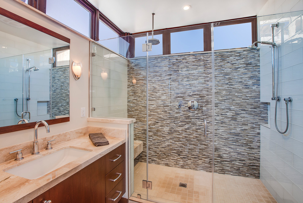 На фото: главная ванная комната среднего размера в современном стиле с плоскими фасадами, темными деревянными фасадами, удлиненной плиткой, белыми стенами, полом из керамической плитки, врезной раковиной и столешницей из известняка