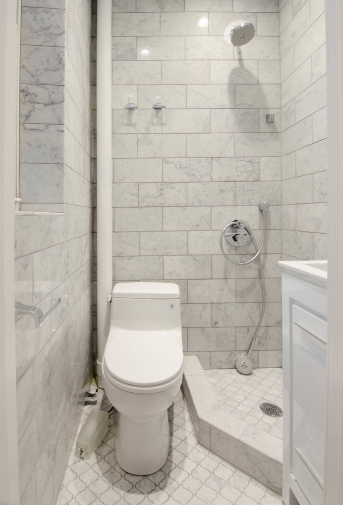 Inspiration for a small contemporary 3/4 white tile and porcelain tile marble floor and gray floor bathroom remodel in New York with flat-panel cabinets, white cabinets, quartz countertops, a one-piece toilet, gray walls and an integrated sink