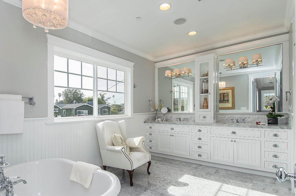 Inspiration for a timeless freestanding bathtub remodel in Los Angeles with white cabinets