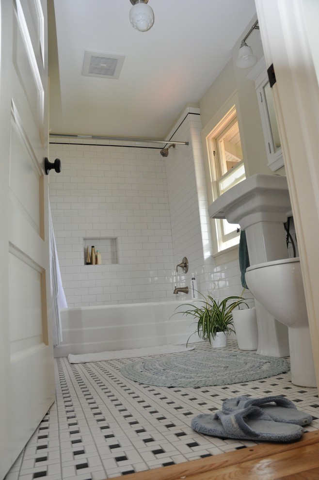 This is an example of a medium sized traditional shower room bathroom in Portland with an alcove bath, a shower/bath combination, white tiles, metro tiles, beige walls, porcelain flooring, a pedestal sink, multi-coloured floors and a shower curtain.