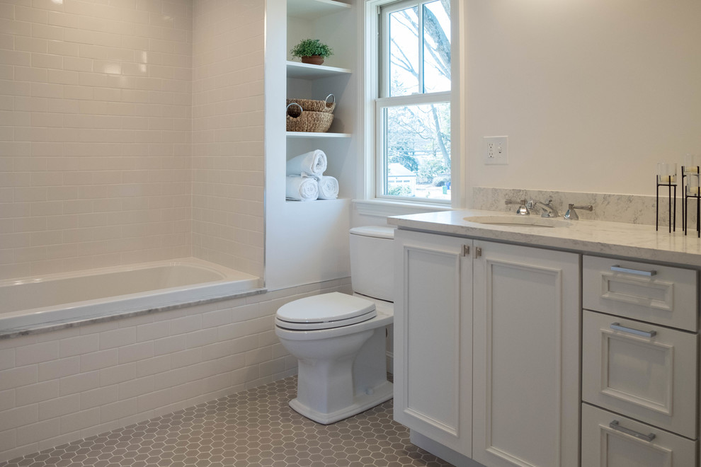 Mid-sized elegant white tile and ceramic tile mosaic tile floor and gray floor bathroom photo in Boston with shaker cabinets, white cabinets, a two-piece toilet, white walls, an undermount sink and marble countertops