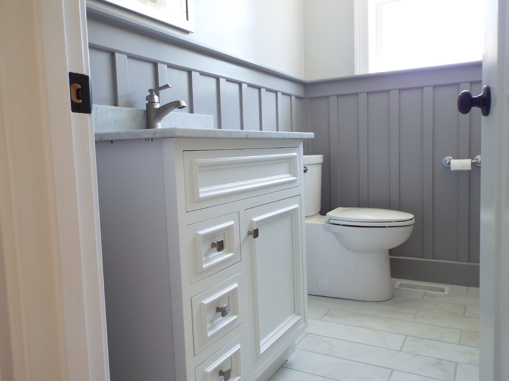Inspiration for a small contemporary 3/4 white tile and stone slab porcelain tile bathroom remodel in Providence with an undermount sink, beaded inset cabinets, white cabinets, marble countertops, a two-piece toilet and gray walls