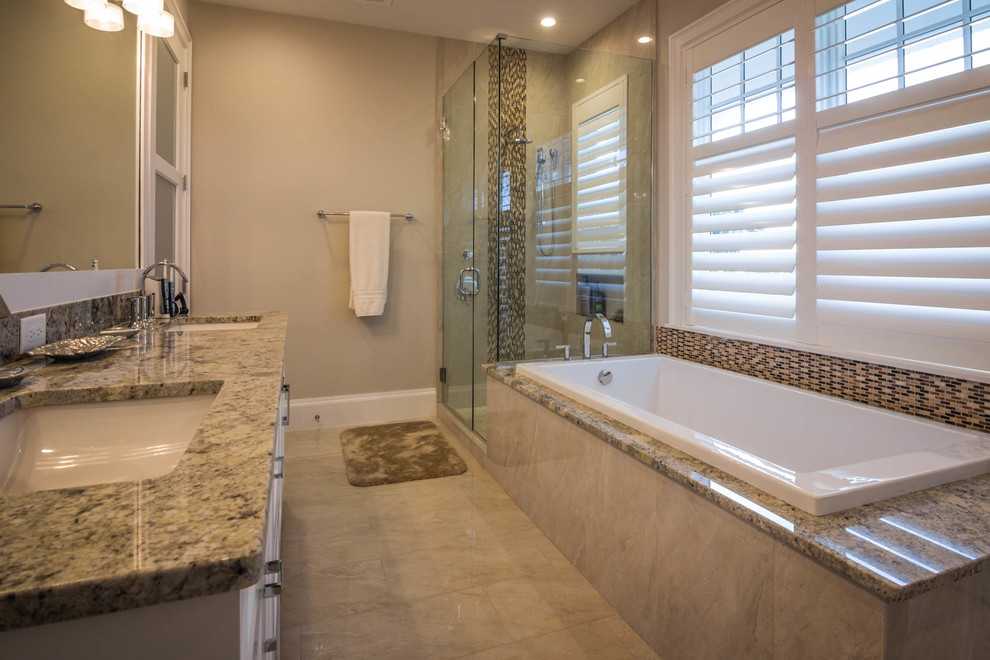 Alcove shower - mid-sized traditional 3/4 multicolored tile and mosaic tile porcelain tile and beige floor alcove shower idea in Phoenix with shaker cabinets, white cabinets, a two-piece toilet, gray walls, an undermount sink, granite countertops and a hinged shower door
