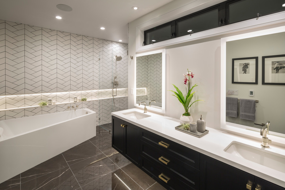 Inspiration for a large traditional ensuite bathroom in San Francisco with shaker cabinets, black cabinets, a corner bath, an alcove shower, a one-piece toilet, white tiles, ceramic tiles, grey walls, marble flooring, a submerged sink, engineered stone worktops, black floors, a hinged door, white worktops, double sinks and a floating vanity unit.