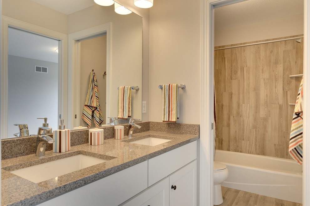 Large traditional shower room bathroom in Minneapolis with a submerged sink, recessed-panel cabinets, white cabinets, an alcove shower, a one-piece toilet, brown tiles, porcelain tiles, white walls and porcelain flooring.
