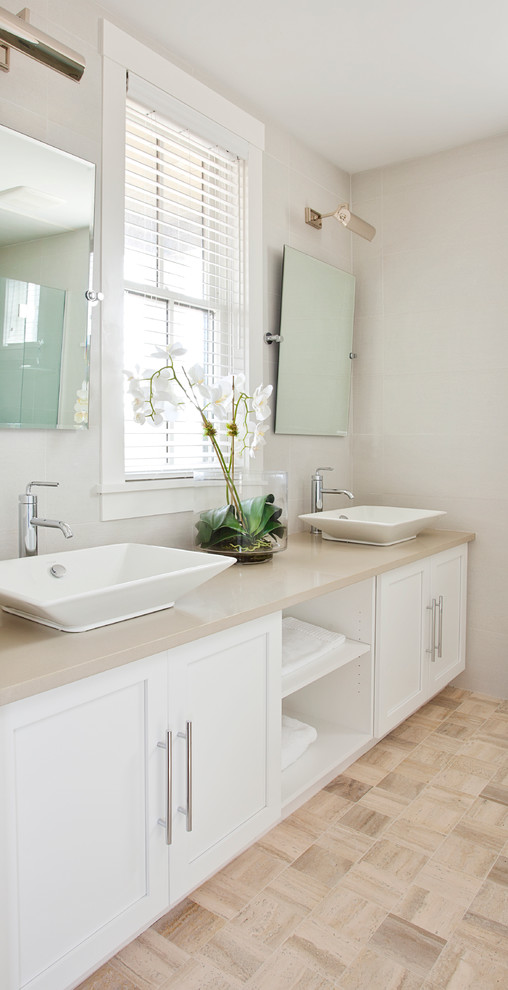 Beach style ensuite bathroom in Boston with a vessel sink, recessed-panel cabinets, white cabinets and white walls.