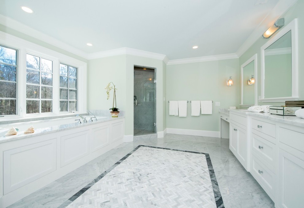 Design ideas for a large classic ensuite bathroom in Boston with recessed-panel cabinets, white cabinets, a built-in bath, a corner shower, black and white tiles, ceramic tiles, green walls, marble flooring, a built-in sink and marble worktops.