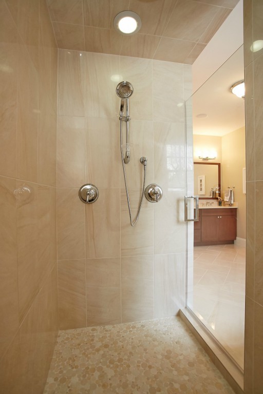 Example of a mid-sized arts and crafts master beige tile and matchstick tile ceramic tile and beige floor bathroom design in DC Metro with shaker cabinets, dark wood cabinets, a two-piece toilet, beige walls, an integrated sink and quartz countertops
