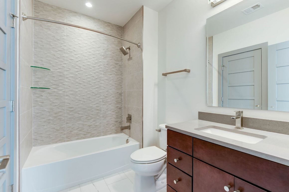 Inspiration for a mid-sized contemporary kids' gray tile and ceramic tile ceramic tile and white floor bathroom remodel in DC Metro with flat-panel cabinets, brown cabinets, a two-piece toilet, white walls, a wall-mount sink, quartz countertops and gray countertops