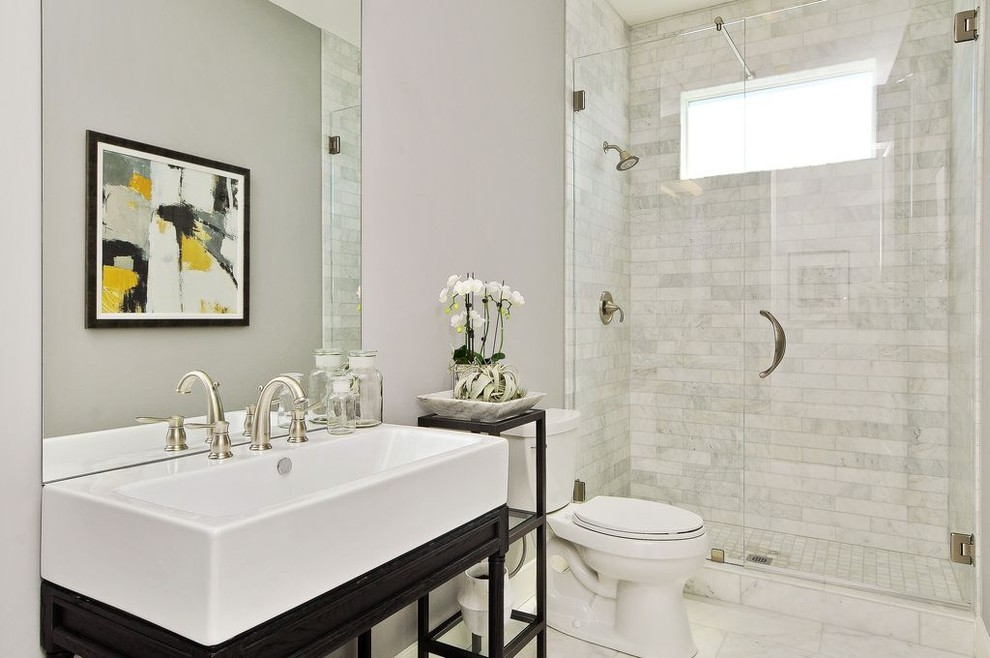 Inspiration for a mid-sized contemporary 3/4 gray tile and stone tile marble floor and white floor alcove shower remodel in San Francisco with open cabinets, black cabinets, a two-piece toilet, gray walls, an integrated sink, quartz countertops and a hinged shower door