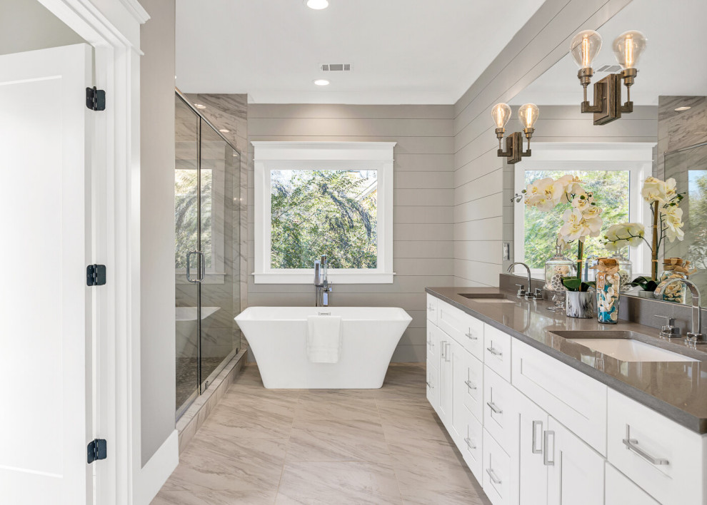 Mid-sized transitional master black and white tile and ceramic tile ceramic tile and white floor bathroom photo in Atlanta with shaker cabinets, gray cabinets, a two-piece toilet, gray walls, an undermount sink, quartzite countertops, a hinged shower door and white countertops