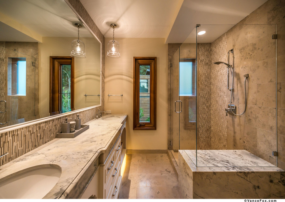 Inspiration for a contemporary stone tile marble floor doorless shower remodel in Sacramento with an undermount sink and white walls