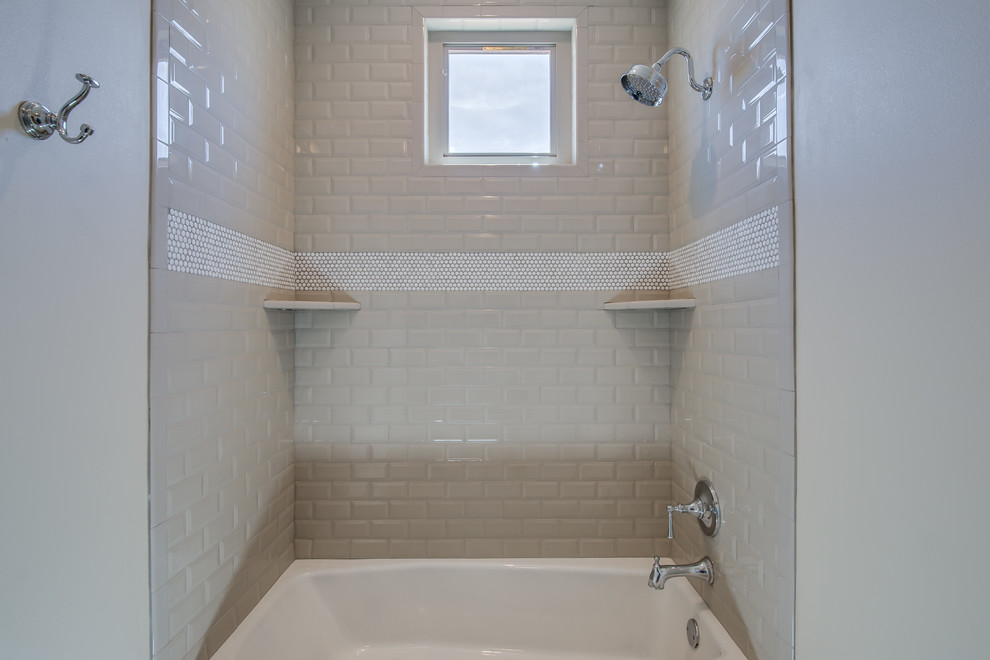 Inspiration for a small classic shower room bathroom in Austin with shaker cabinets, white cabinets, an alcove bath, a shower/bath combination, white tiles, metro tiles, beige walls, ceramic flooring, a submerged sink, engineered stone worktops, beige floors and white worktops.