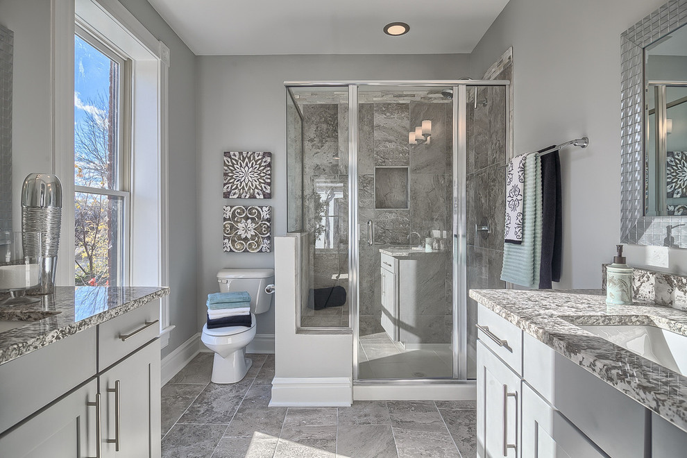 Inspiration for a medium sized traditional ensuite bathroom in St Louis with grey cabinets, a corner shower, grey tiles, porcelain tiles, grey walls, porcelain flooring and granite worktops.