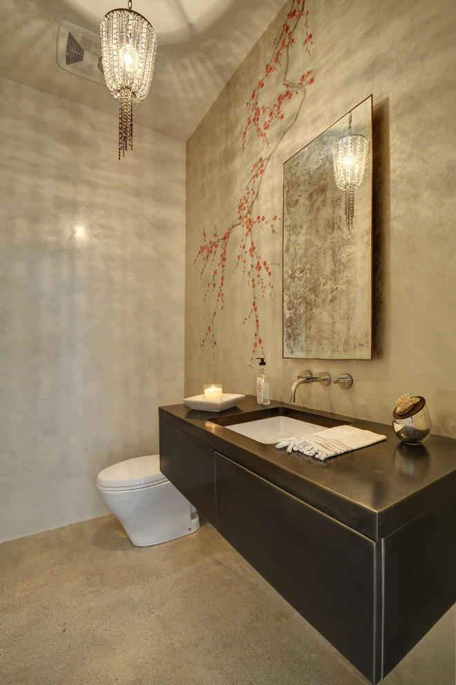 Photo of a contemporary bathroom in Austin with a submerged sink, flat-panel cabinets, grey walls and concrete flooring.