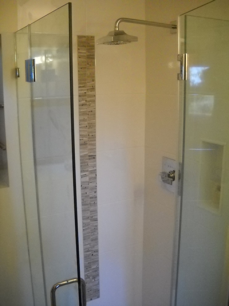 Example of a mid-sized trendy 3/4 white tile and ceramic tile slate floor and gray floor bathroom design in San Francisco with flat-panel cabinets, orange cabinets, a one-piece toilet, white walls, a vessel sink, quartz countertops and a hinged shower door
