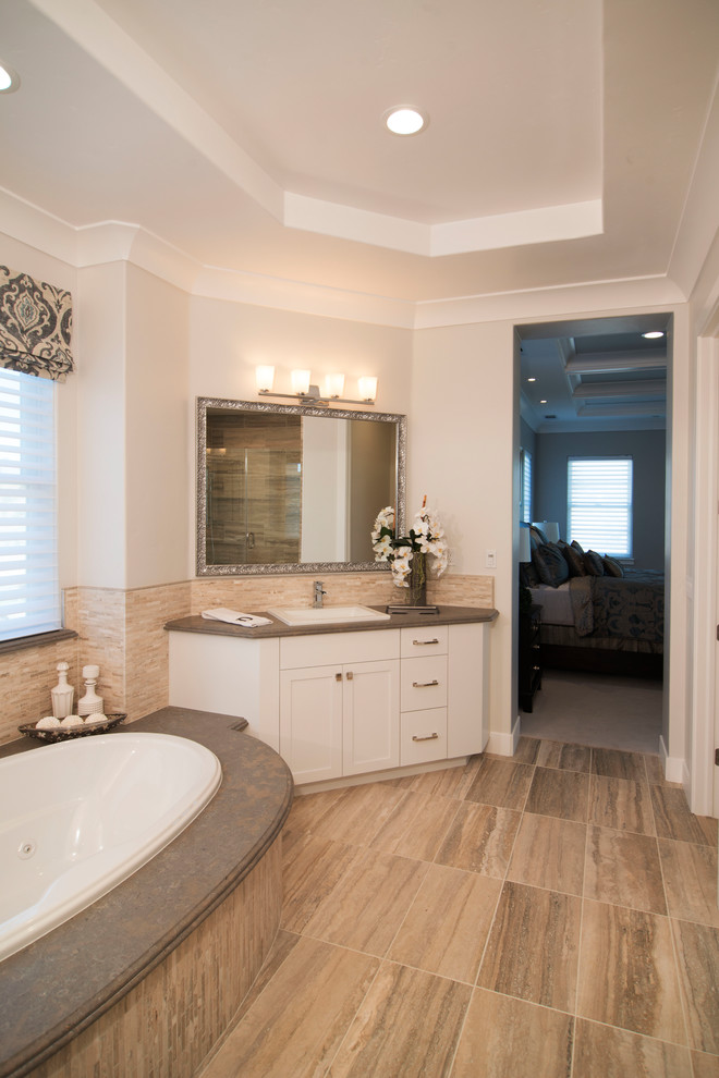 This is an example of a classic ensuite bathroom in San Francisco with shaker cabinets and white cabinets.