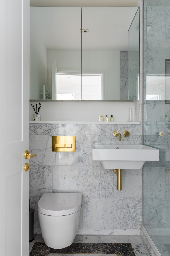 Example of a small transitional 3/4 gray tile gray floor and single-sink bathroom design in London with a wall-mount toilet, a wall-mount sink and a hinged shower door