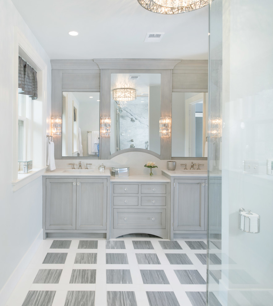 Example of a large transitional gray tile and stone tile marble floor bathroom design in Kansas City with recessed-panel cabinets, gray cabinets, gray walls, an undermount sink and quartz countertops