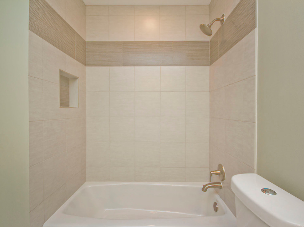 Photo of a small traditional family bathroom in Austin with a submerged sink, flat-panel cabinets, white cabinets, engineered stone worktops, a built-in bath, a shower/bath combination, a one-piece toilet, white tiles, porcelain tiles, green walls and mosaic tile flooring.