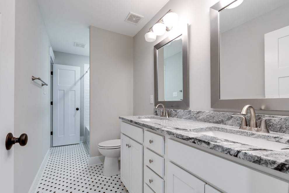 Bathroom - large farmhouse kids' ceramic tile, multicolored floor and double-sink bathroom idea in Richmond with recessed-panel cabinets, white cabinets, a two-piece toilet, gray walls, an undermount sink, granite countertops, multicolored countertops and a built-in vanity